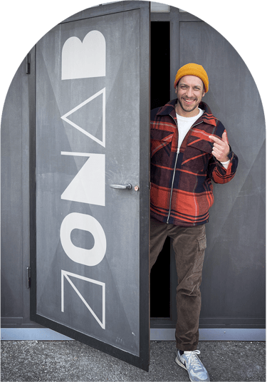 a man standing in front of a door with a door open