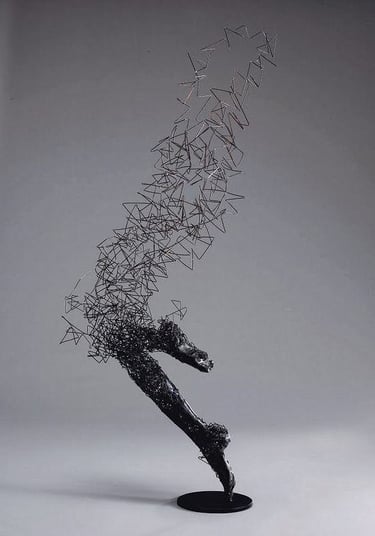 a sculpture of a horse running through a field