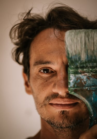 a man with a brush and a paintbrush in his hand