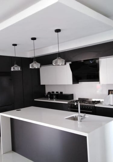 a kitchen with a refrigerator, refrigerator, and refrigerator freezer