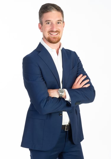 a man in a suit and white shirt