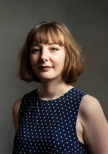 a woman with a blue dress and a white polka dot dot dot dot dot dot