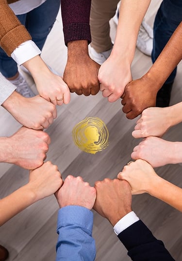 a group of people holding hands together in a circle