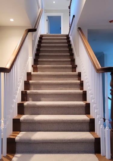 Custom wood staircase design with natural wood railings for modern and classic interiors