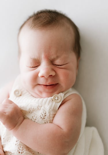 Baby stretching during calm newborn photography session in Adelaide Hills