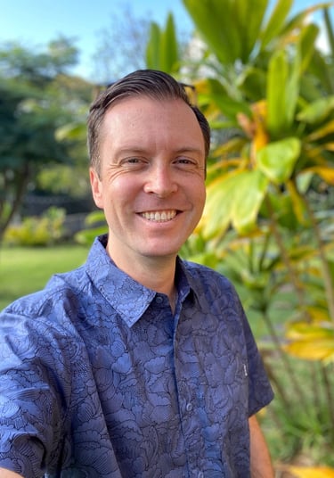 man wearing blue aloha shirt
