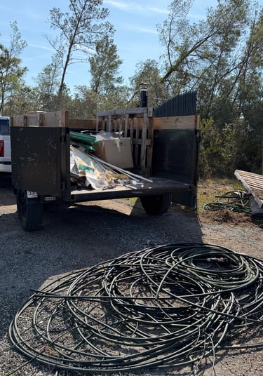 Junk removal dump trailer loaded with construction debris in Deltona, FL by SunWave Junk Removal