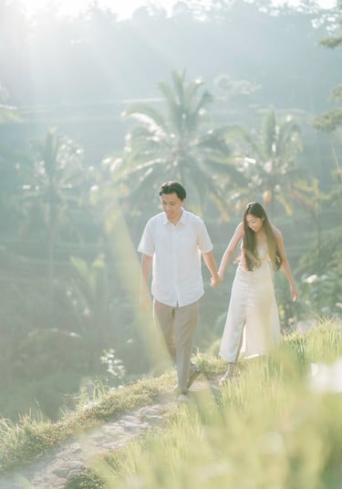 Backlit intimate couple embrace during a sunrise photography session at Tegalalang Ubud Bali.
