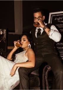 Bride and groom holding champagne glasses for toast
