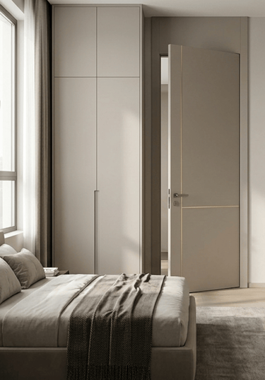 Modern minimalist bedroom featuring a sleek greige built-in wardrobe and matching gold-inlay door.