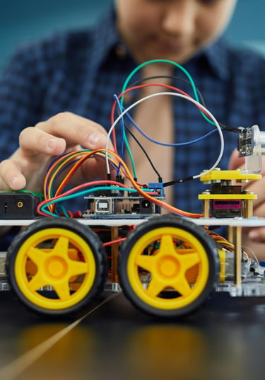 a girl is holding a arduino car