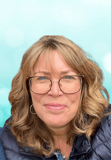 a woman with glasses and a blue jacket