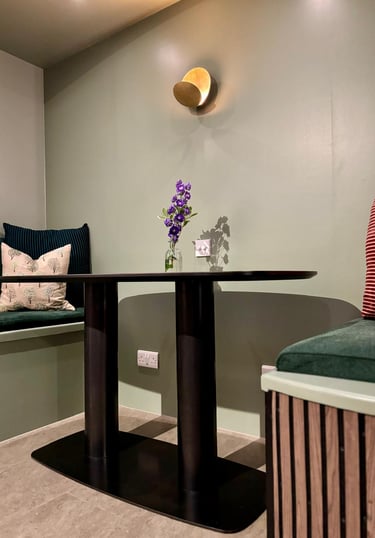 pods and bespoke table. wall light