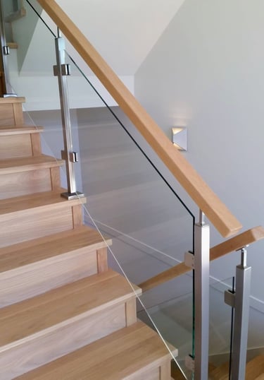 Glass railing staircase design for open and modern spaces in Vancouver homes
