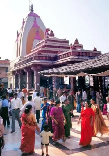 a group of people walking around a large building