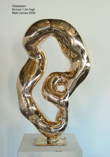 a highly polished reflective abstract bronze sculpture 