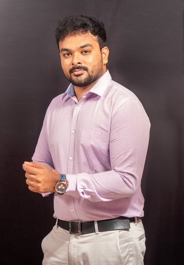 a man in a purple shirt and white pants