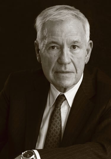 a man in a suit and tie with a watch