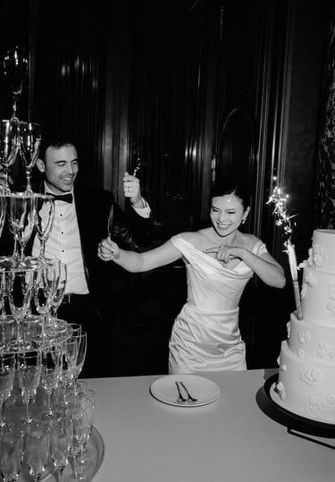 couple celebrating their luxury wedding cake