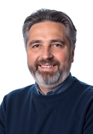 Author Galen Manning in blue sweater