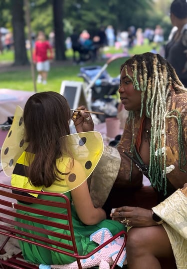 face painting a child at a halloween event