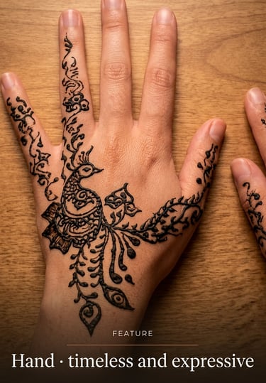 Detailed peacock henna tattoo design on a person's hand over a wooden background.