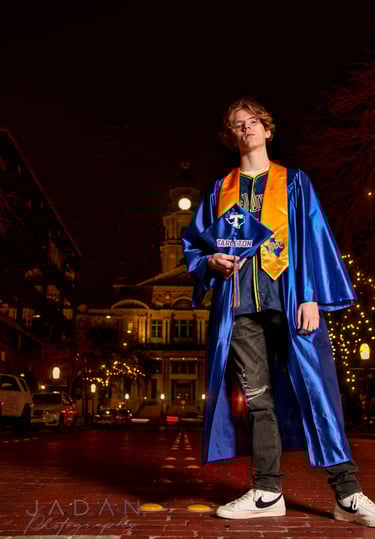 high school senior photo shot at night in downtown fort worth of the dfw metroplex