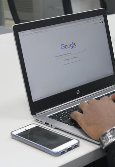 man typing on laptop