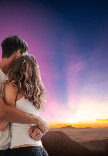 a man and woman embracing in the sunraising