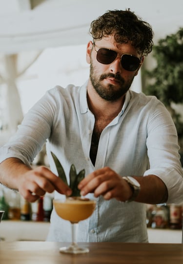 a bartender preparing a cocktail