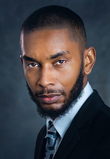 a man with a beard and a tie on a suit