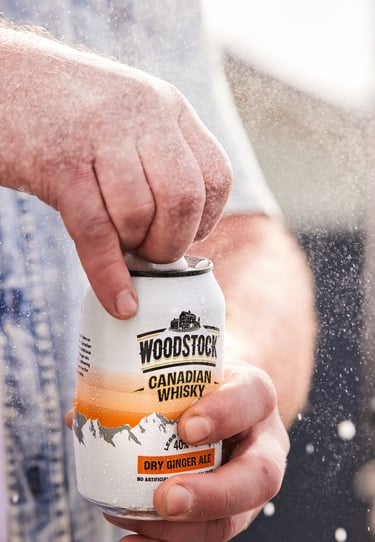 Product photography - a man holding a can of woodstock