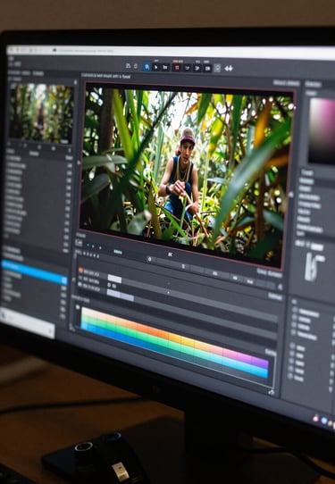 Detailed close-up of a 4K monitor showing color grading software interfaces with a high-definition video frame.
