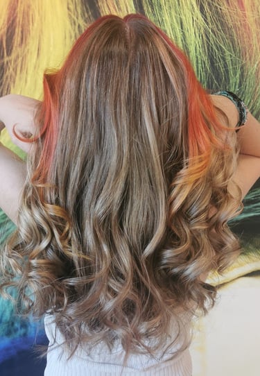 a woman with long hair and a rainbow colored hair