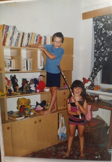 A young girl playing with a young boy