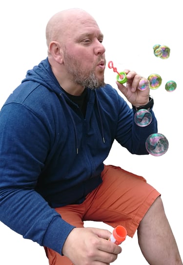 a man blowing bubbles in the air