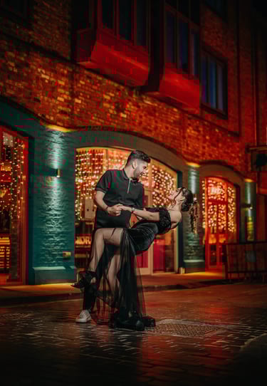 Couple dancing at night under warm streetlights in York, photographed by Fred Art Studio.