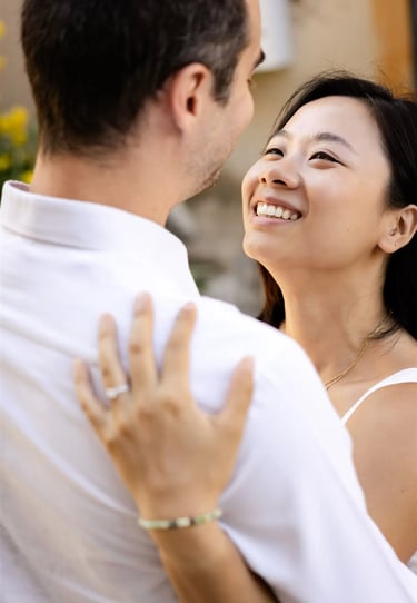 Provence engagement photographer — woman gazing into her partner’s eyes while embracing