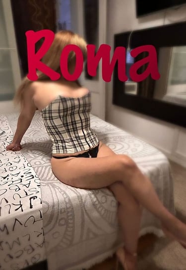 a woman in a plaidered top and panties on a bed