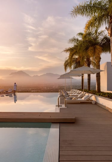 a luxury resort infinity pool with expansive mountain views