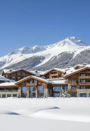 Luxury wooden chalets at the foot of snowy mountains in Avoriaz ski resort, French Alps.