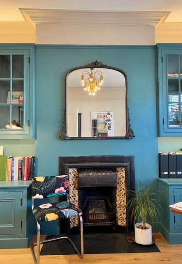 Mid century light fixture, recycled chair in home office