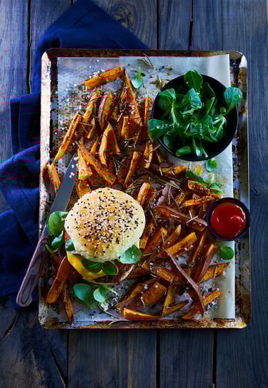 a tray of food on a tray with a knife and fork