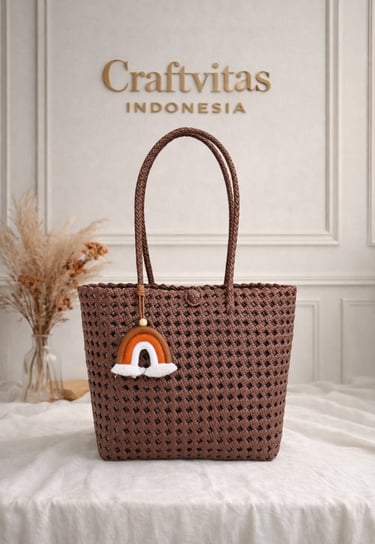 Brown handmade woven plastic tote bag Sekar series with charm detail, eco friendly fashion bag