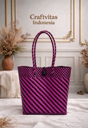 Handwoven plastic tote bag with Indonesian batik diagonal pattern in pink and black, sustainable handmade bag