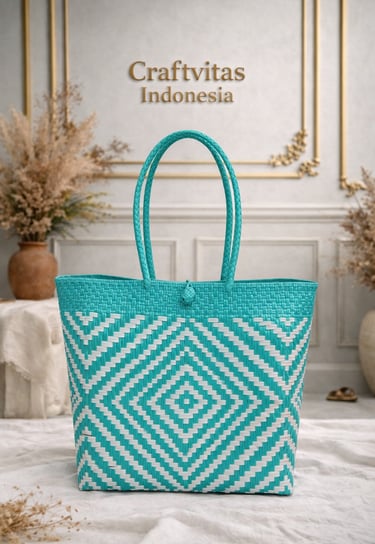 Handmade plastic woven bag with Indonesian batik geometric pattern in teal and white
