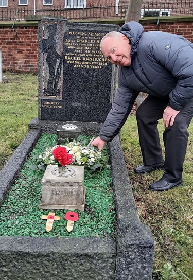 John Hughes laying a wreath in remembrance of his grandfather, Sergeant Charles Hughes