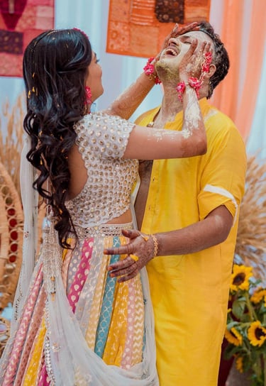 a man and woman in a yellow and white dress