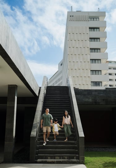 Family walking together at The Meru Sanur Bali during a relaxed family photography session