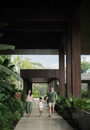 Parents walking with their children at The Meru Sanur Bali family photography session